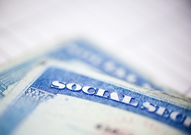 Blurred Social Security Cards on Table